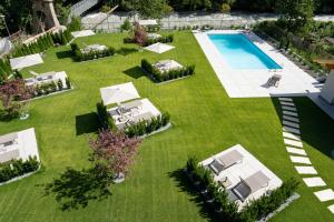 an aerial view of a yard with a swimming pool at Self Service Hotel Schnalser Hof in Naturno