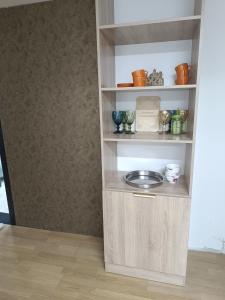 a book shelf with a plate in a room at Urban hostel Saryarka in Astana