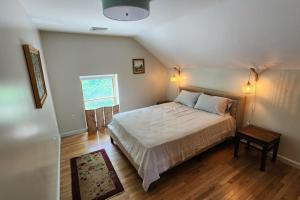 a bedroom with a large bed in a attic at Shelburne Falls on Main in Shelburne