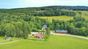an aerial view of a house in the middle of a field at Hus Gillberga in Varmlands Nysater