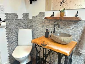 a bathroom with a sink and a toilet at Hus Gillberga in Varmlands Nysater +44 photos