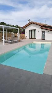 a swimming pool in front of a house at Ripamè B&B in Ripa Teatina