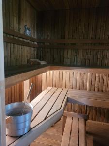an inside of a sauna with a pot of liquid at Purje in Pärnu