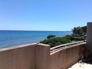 a view of the ocean from a wall at Maria beach in San-Nicolao
