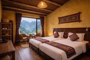 a bedroom with two beds and a view of a mountain at OH Pu Luong Homestay in Làng Bang +240 photos