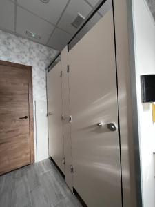 a hallway with a large metal door in a room at El Palmar in Tobarra