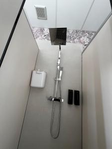 a bathroom with a shower with a ceiling at El Palmar in Tobarra