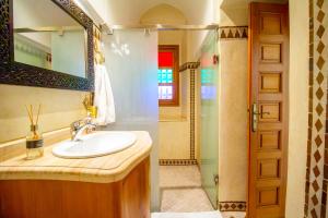 a bathroom with a sink and a shower at Riad Zaki Marrakech in Marrakesh +54 photos