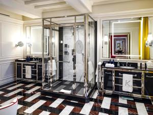 a bathroom with a shower and two sinks at J.K. Place Roma - The Leading Hotels of the World in Rome +217 photos