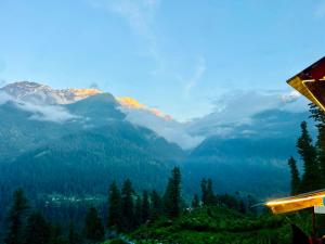 a view of a valley with trees and mountains at Skyblue cafe in Tosh +9 photos
