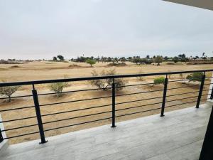 a balcony with a view of a field at Carlo's Fairview Boutique - Hotel in Walvis Bay +4 photos