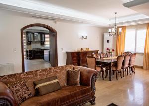 a living room with a couch and a table at Villa Tiara by HolidayKeys in Kyrenia