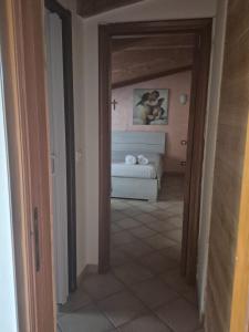 a hallway leading to a bedroom with a bed at VILLA ANNAMARIA in Montesilvano +31 photos