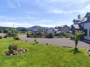 a house in a residential neighborhood with a driveway at Radharc Sléibhe in Kilgarvan