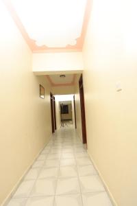 a hallway of an empty room with a ceiling at Grand View Hotel in Fort Portal