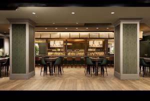 a restaurant with a bar with tables and chairs at Chelsea Hotel Toronto in Toronto