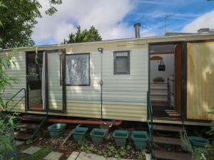 an rv is parked in a yard at 10 Cater Gardens in Guildford