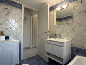 a bathroom with a white sink and a mirror at Anemochadi in Agios Sostis +24 photos