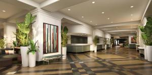 a lobby with potted plants in a building at Chelsea Hotel Toronto in Toronto +24 photos