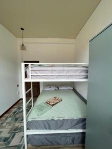 a bedroom with two bunk beds in a room at Alpha White in Koshkolʼ