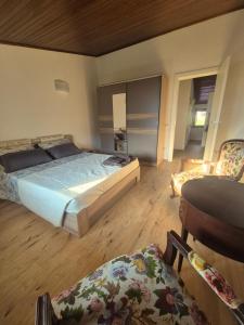 a bedroom with a bed and a table and a chair at Luna in Lierna +10 photos