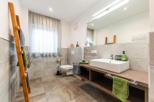 a bathroom with a sink and a toilet at Apartment Zielspitz in Parcines +65 photos