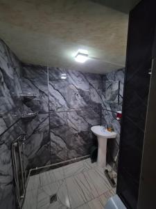 a bathroom with a shower and a sink at Guest House in Ureki in Ureki +18 photos