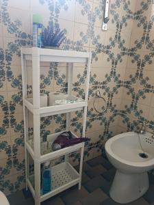 a bathroom with a toilet and a sink at Casa da Corredoura in Penafiel +33 photos