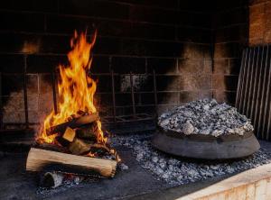 a fire pit with a pot of fire at Holiday home Damian in Zagreb