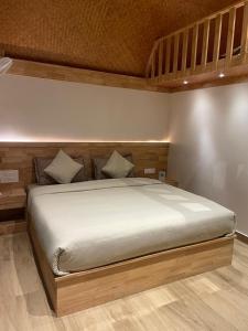 a large bed in a bedroom with at Wanderlust Beach Villa in Agatti