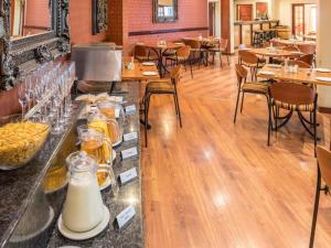 a restaurant with a counter with drinks on it at Constantia Hotel and Conference Centre in Midrand