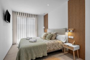 a bedroom with a bed and a large window at Casa Maku in San Pedro del Pinatar +33 photos