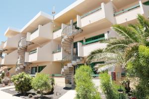 an external view of a building with a spiral staircase at Rayito de sol 3 in Costa de Antigua