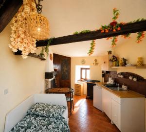 a kitchen and living room with a bed in a room at Lo Chalet del Borgo in Rivisondoli +27 photos