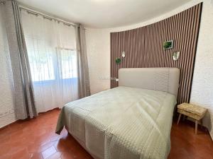 a bedroom with a bed and a large window at Villa Peñón View in Calpe