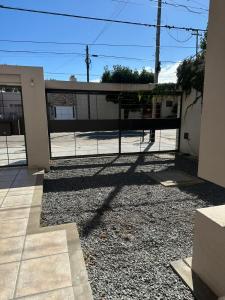 a gate to a house with a fence at Descanso Sereno in Junín