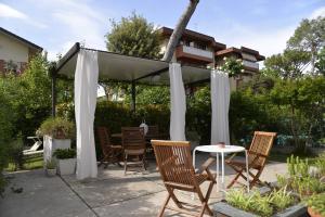 a gazebo with chairs and a table at Bed And Breakfast 22 Garibaldi Home in Riccione