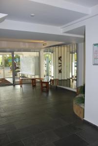 a lobby of a building with a table and chairs at Haus Nautic Whg 810 Seesicht in Cuxhaven +24 photos