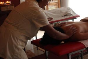 a woman giving a young child a massage at La Quinta Resort in Merlo