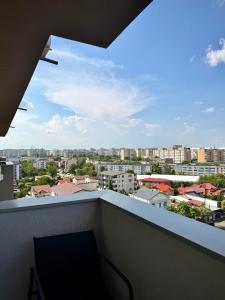 a balcony with a view of a city at Contemporary Studio with Balcony - New Building in Bucharest