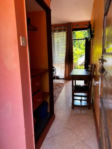 a dining room with a mirror and a table at PRIMESHADE GUESTHOUSE in Malindi