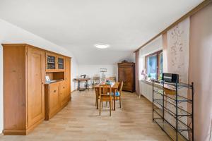 a kitchen and dining room with a table and chairs at Ferienwohnung Panorama in Freiamt