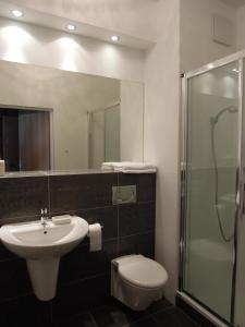 Kúpeľňa v ubytovaní Apartamenty Karawela - Nadmorski Dwór