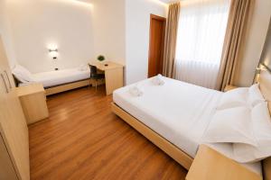 Llit o llits en una habitació de GRIF Hotel