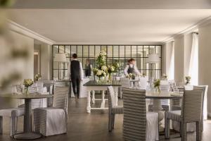 a rendering of a dining room with tables and chairs at COMO Cordeillan-Bages in Pauillac