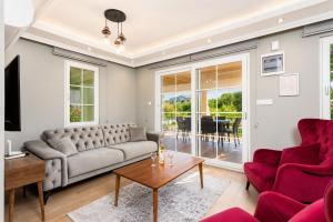 a living room with a couch and a table at Villa Delfin in Ortaca