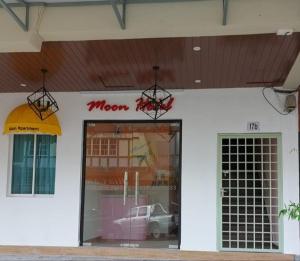 a store front with a window with a car in it at Moon Hotel BRINCHANG Town in Brinchang +7 photos
