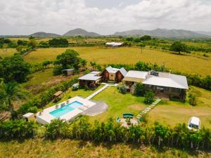 an aerial view of a house with a swimming pool at Villa Campestre by Otium in Higuey