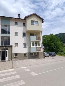 a large building on the side of a street at Apartman Angela in Foča