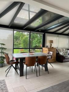 a dining room with a table and chairs at Chez Virginie in Rhodes